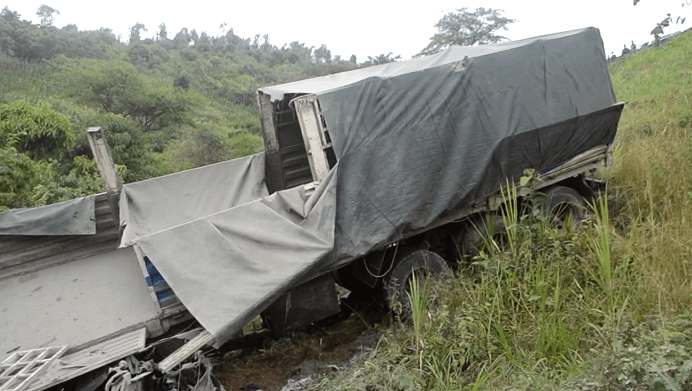 Two injured, One dead as lorry overturns on Highway