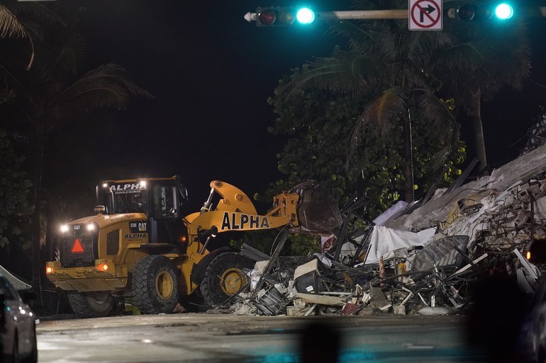 Apartment building collapses: At least 12 dead