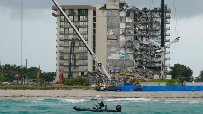 18 killed in apartment building collapse - 2 children among them