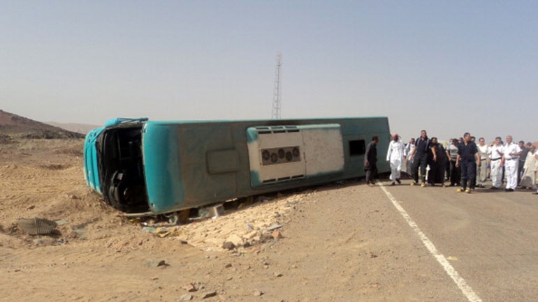 Twelve people killed in bus overturn