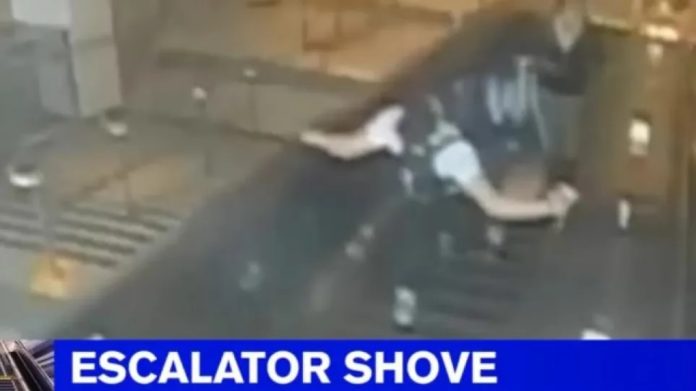 Man kicks woman and throws her down escalator - Watch Video