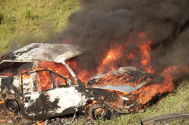 Car goes up in flames after crashing into a pile of soil