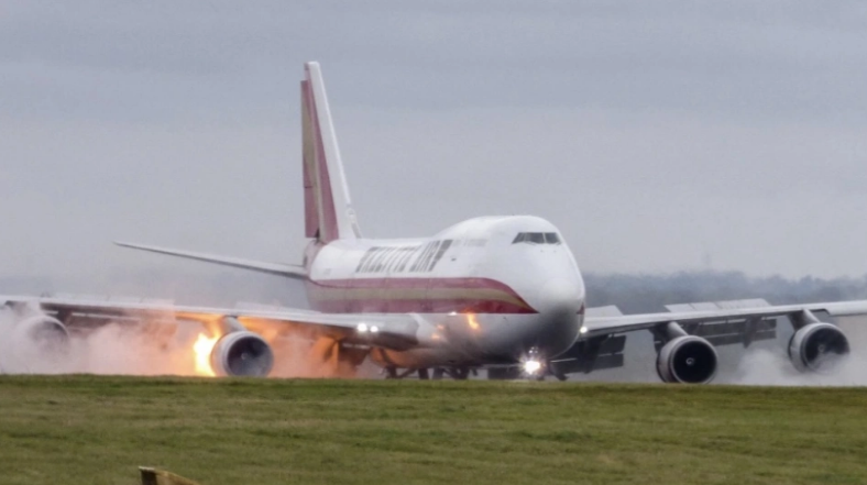 Plane catches fire as it lands at an airport