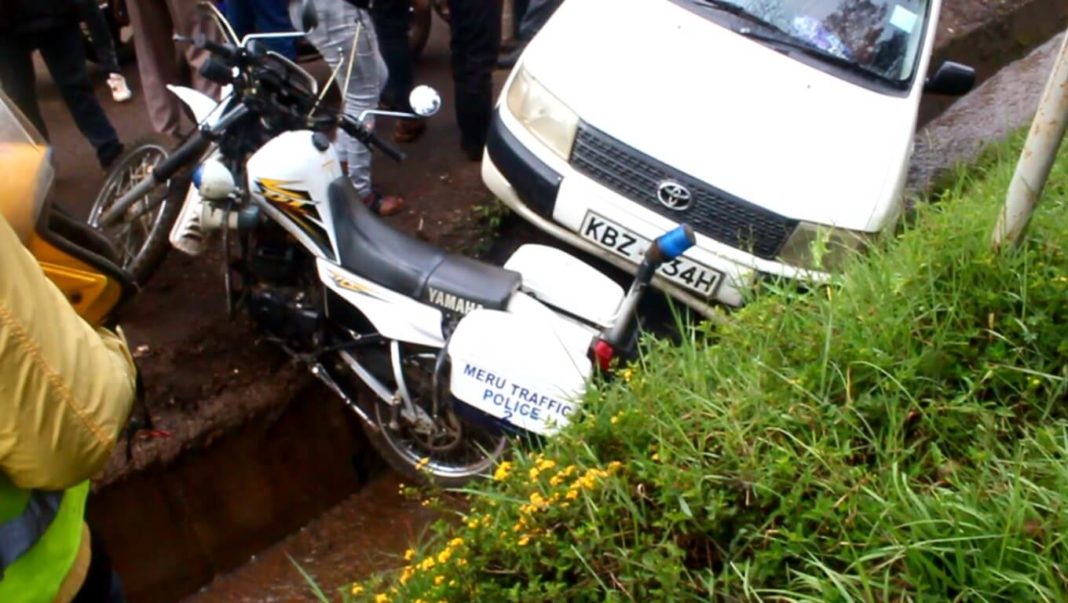 Traffic Police Motorcycle knocked down by reversing car
